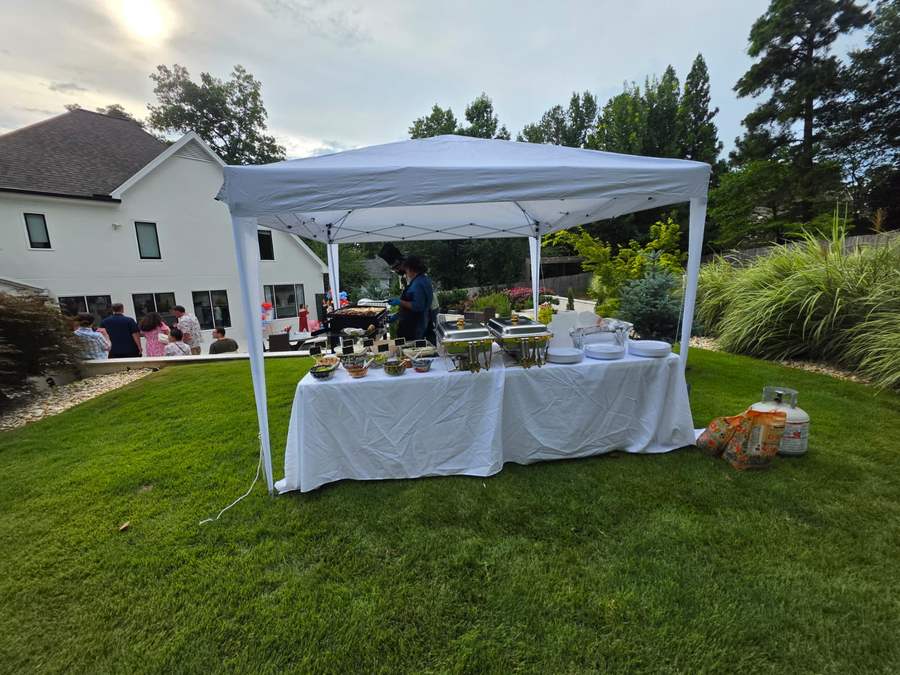 Taquiza catering canopy at a backyard party
