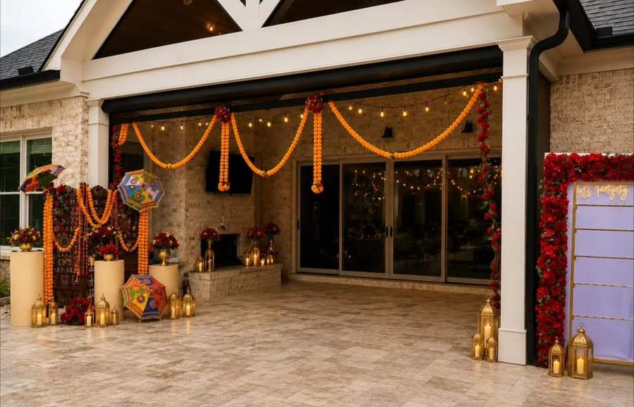 Patio decorated with marigold garlands, red roses and lanterns