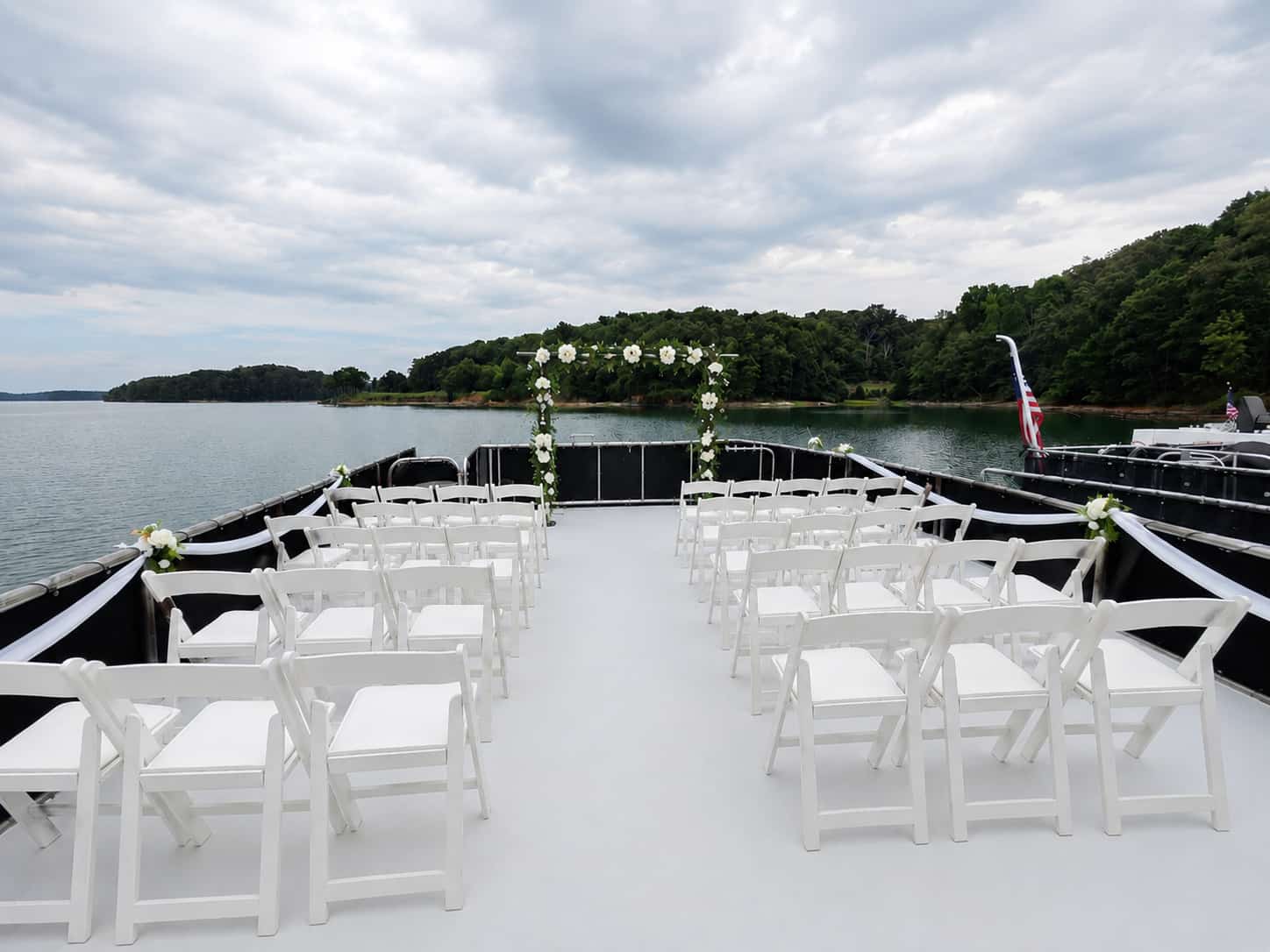 Grass backyard with an unstyled white tent before the event