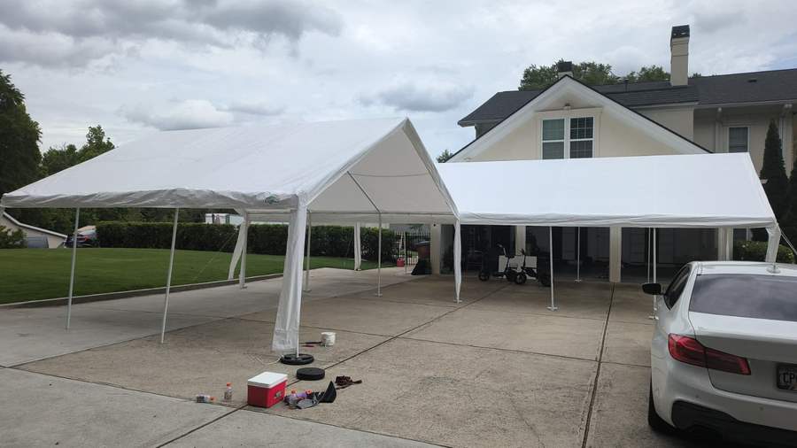 Two tents installed on a driveway